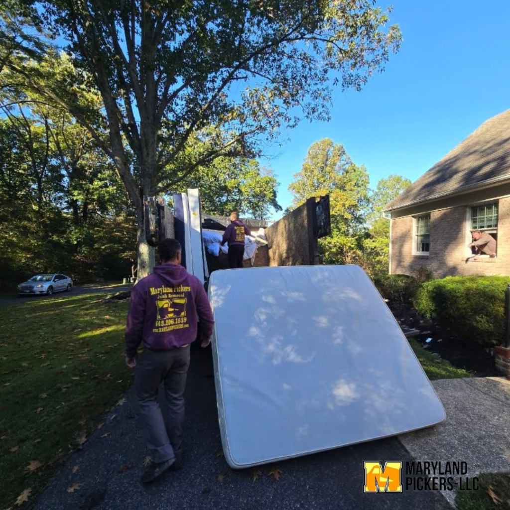 A photo of a mattress removal in central Maryland being loaded up by the junk removal company, Maryland Pickers.